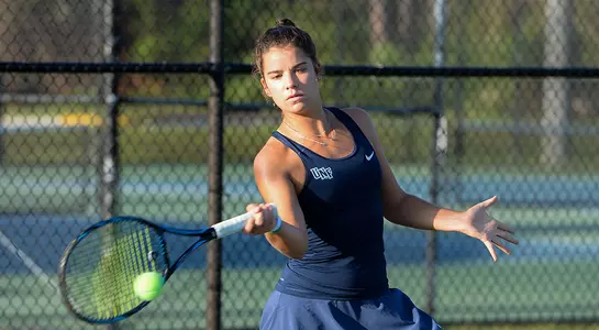 Eva Nyikos returns the ball with a forehand.