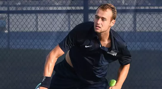 Lasse Muscheites serves the tennis ball.