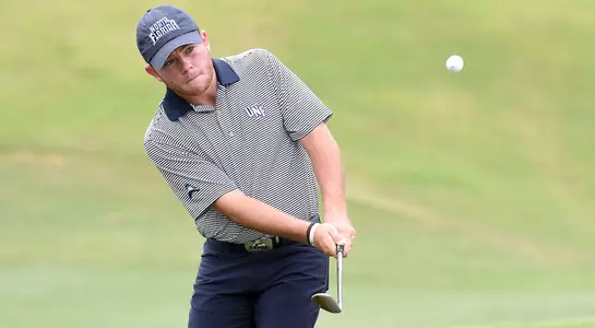 Andrew Alligood finishes a chip shot from the fairway