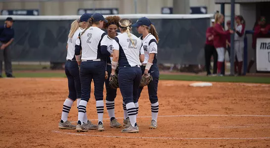 Softball's infield huddles up before the inning against Florida State.