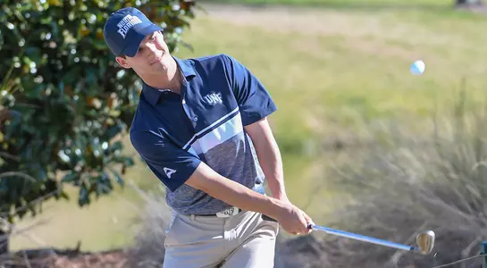 Philip Knowles hits a chip shot from near the green