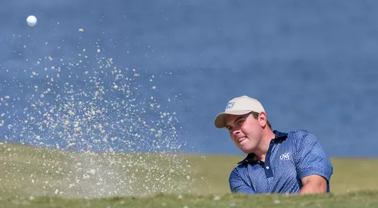 Michael Mattiace watches his shot fly out of the sand trap