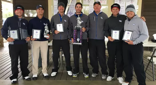 The UNF men's golf team poses with their championship trophy at the 2018 Furman Intercollegiate
