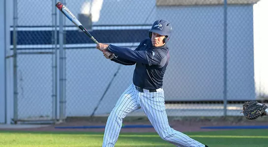 Blake Voyles swinging a baseball bat