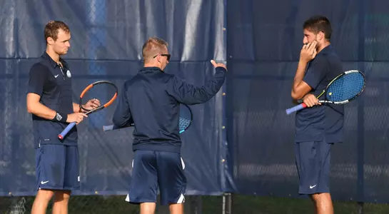 Coach Lucas talks to Jefta Kecic and Lasse Muscheites at practice.