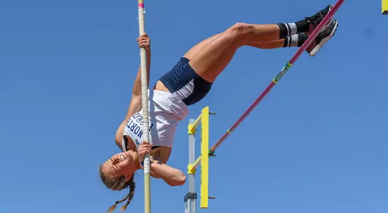 Louisa Washburn clears the pole vault crossbar