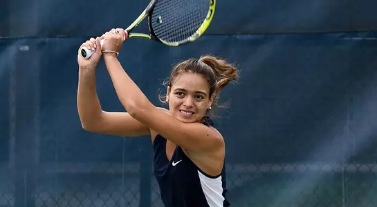 Lucia Montano returns the ball over the net.