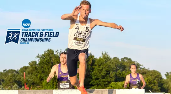 Fynn Timm jumps over a barrier in the 3000 meter steeplechase