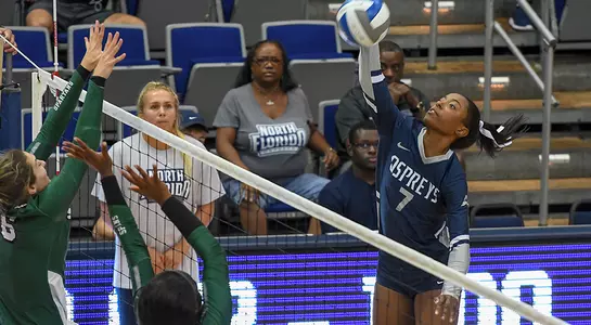 Sophomore Devyn Wheeler makes an attack attempt against two USC Upstate blockers at the net.