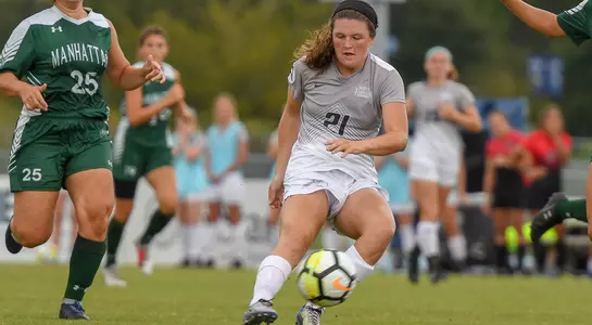 Kendra Hoffman passes the ball against Manahattan