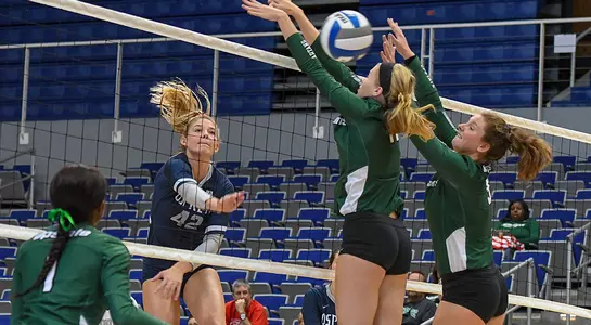 Taryn Griffey connects on an attack attempt that passes through two USC Upstate defenders