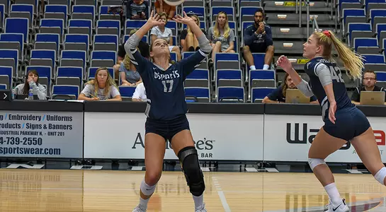 Madilyn McCarty gets in a setting motion with the ball above her