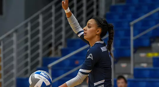 Gabby O'Connell holds the ball as she begins to make a serve.