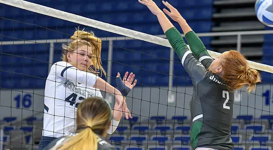 Taryn Griffey hits the volleyball over the net and past a Jacksonville blocker.