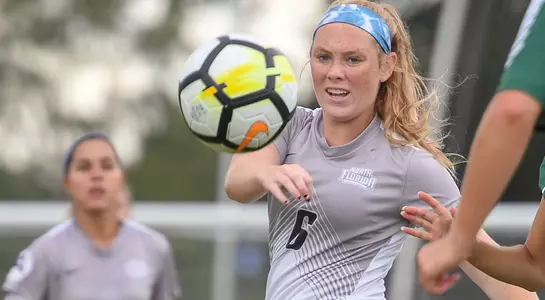 Brandi Walker watches the ball off her foot in the game