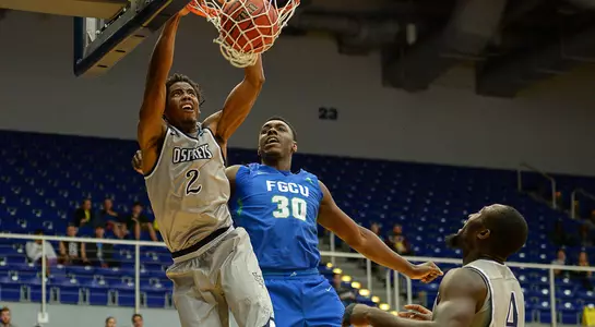 Wajid Aminu dunks on an FGCU defender in game at UNF Arena