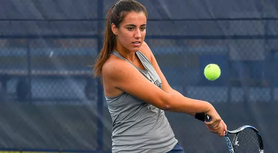 Valentina Marriotto looks on at the ball before hitting a two-handed backhand.