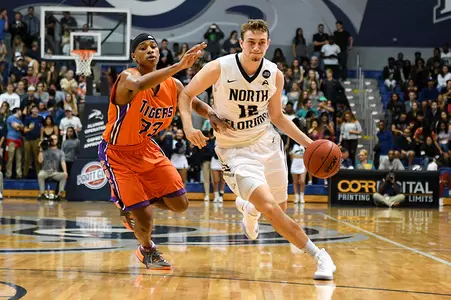 Ryan Burkhardt dribbles around a defender