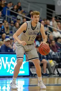 Ryan Burkhardt dribbles a basketball