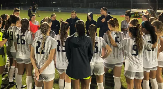 North Florida women's soccer in team huddle post match