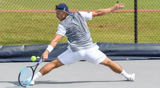 Joe Ellis stretches out with a fancy volley