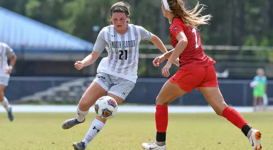 Kendra Hoffman dribbles the ball past a defender
