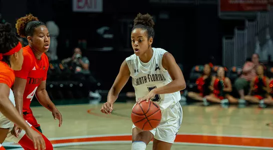 Alexis Gordon dribbles the basketball at Miami