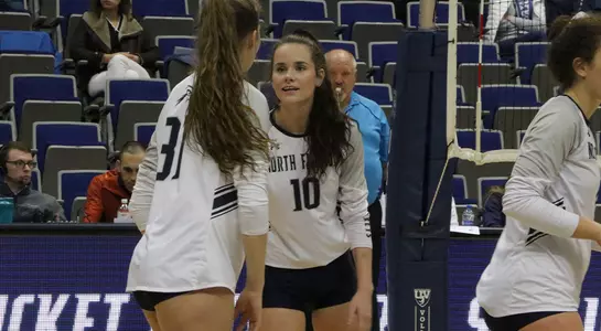Grace Youngblood and Bria Plante discussing the next play.