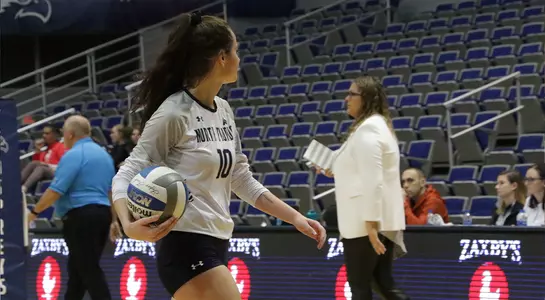 Grace Youngblood heads to the back line to serve.