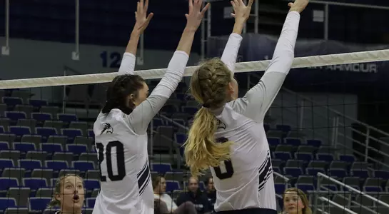 Maddie Boyd and Grace Peterson go for a block.