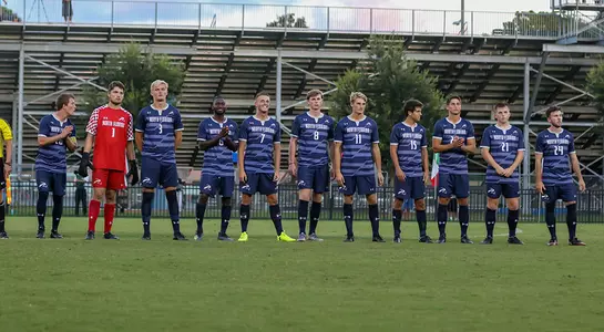 Men's soccer lines up for starting announcements.