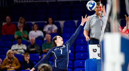 Solimar Cestero jumping to get the ball over the net.