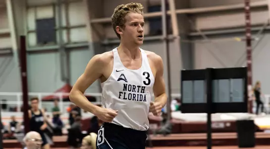 Noah Perkins runs across the finish line in the 3000m race at the Carolina Challenge