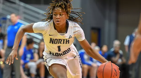 Arianna Emanuel-Wright dribbles the basketball toward the basket
