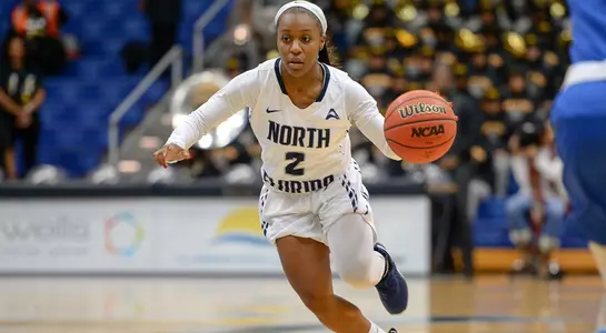 Ty Purifoy dribbles the basketball
