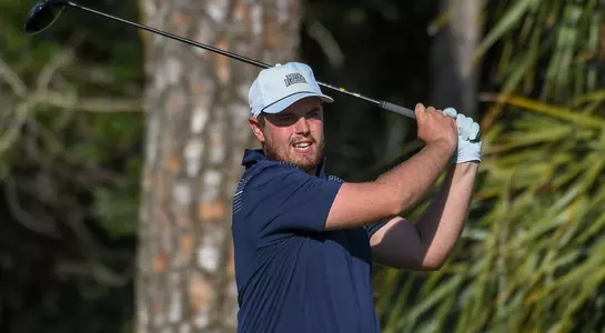 Michael Mattiace follows through on his swing and watches the ball flight