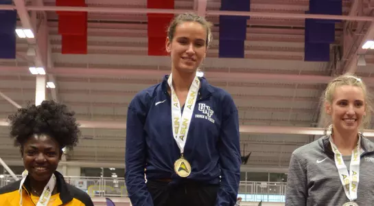 Sonja Andenmatten poses on top of podium with her gold medal after winning ASUN 800m title