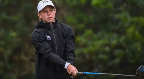 Sydney Shrader hits a drive in the rain