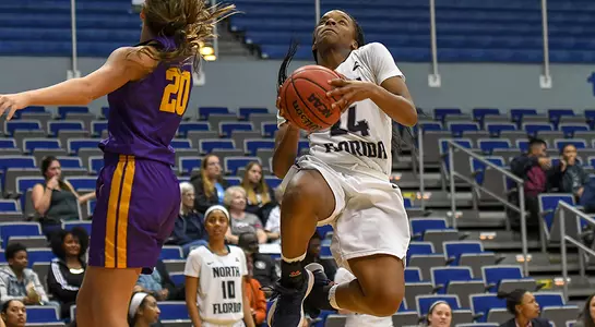 Junior guard Janesha Green drives in for the layup against Lipscomb, avoiding a defender.