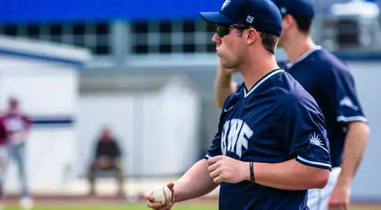 Chris Matthias plays catch with teammate before game