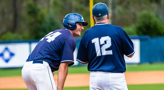 Tanner Murphy listens to head coach Tim Parenton at base