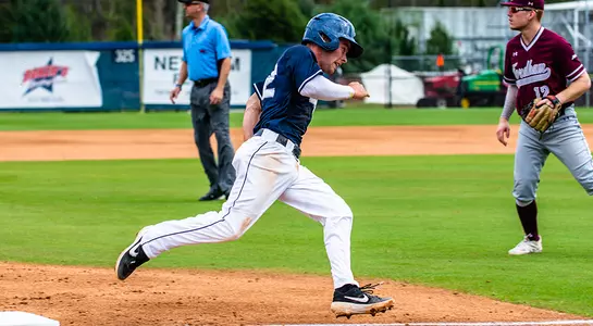 Jay Prather rounds base to get to home