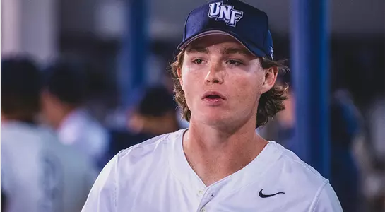 Grant Grodi looks on in the dugout.