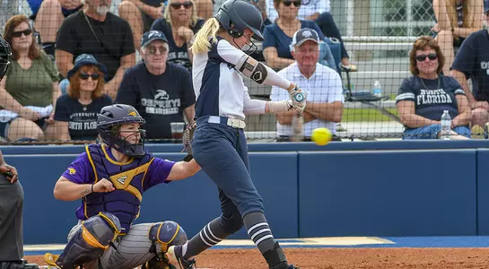 UNF softball player swings at bat