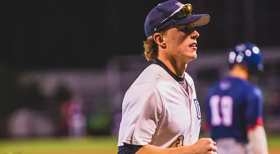 Tanner May runs back into the dugout.