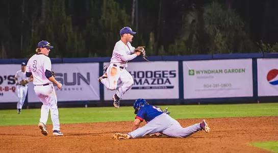 Jay Prather jumps high when trying to turn a double play.