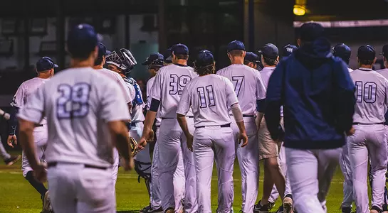 North Florida Baseball team walks out onto the field.