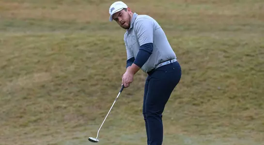 Mike Mattiace putts the ball on the green