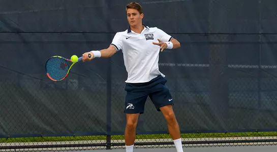 Action shot of Dominik Barton hitting a forehand.