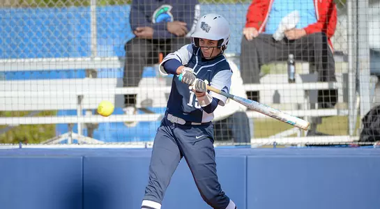 Megan Woodson swinging at an oncoming pitch.